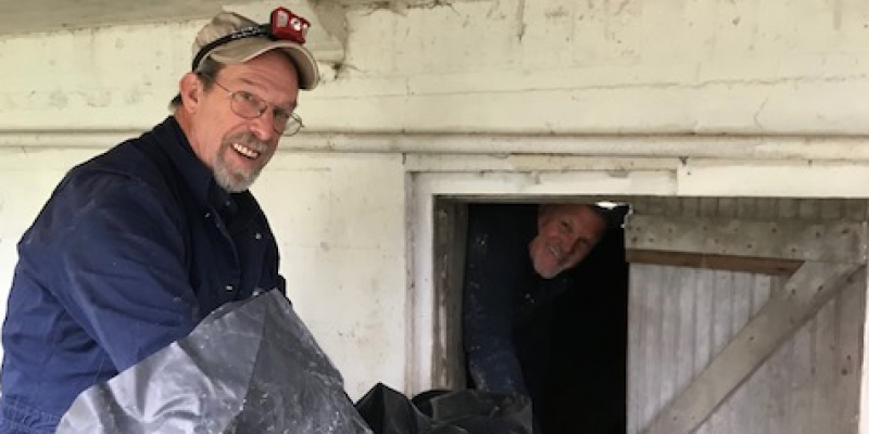 Pest control technicians installing vapor barrier in crawl space. Interstate Pest Management serving Portland OR & Vancouver WA talks about Giving Back to Our Community.
