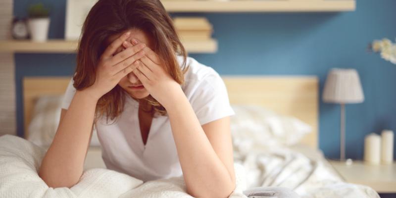 Woman looking distressed. Interstate Pest Management serving Portland OR & Vancouver WA talks about How to Spot a Bed Bug Infestation.