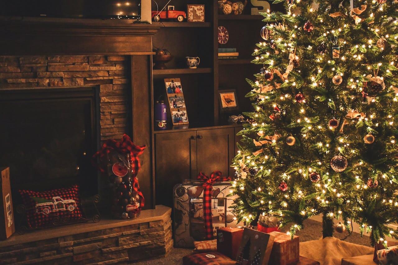 Hero image for a blog post titled "Pest-Proofing Your Home for the Holidays" | A home decorated for the holidays with a lit Christmas tree