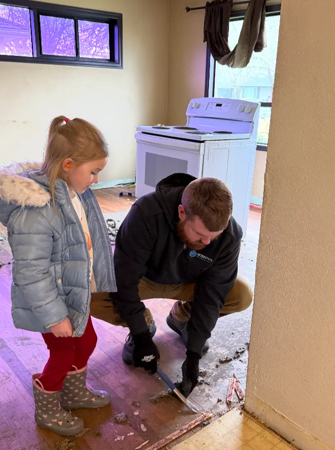 Ryan Thorstenson volunteering with his family to get the new kitchen floors prepared for a makeover at the Imago Dei Ministry Home in Longview, WA