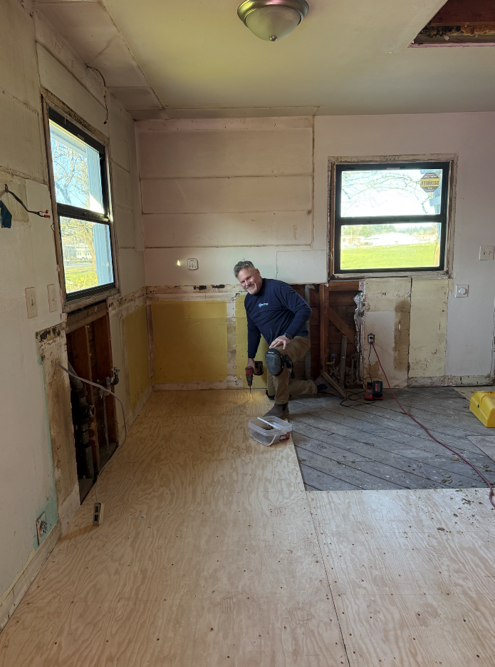 Brad Thorstenson installing a Subfloor at the Imago Dei Ministry Homes new Maternity home in Longview, WA